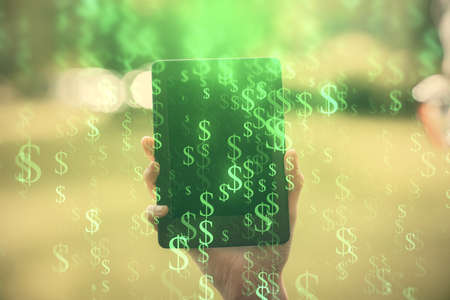 Double exposure of forex chart sketch hologram and woman holding and using a mobile device. Financial market concept.の写真素材