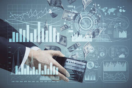 Multi exposure of financial graph drawing hologram and USA dollars bills and man hands. Analysis...