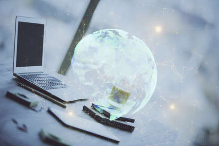 Computer on desktop with social network hologram. Double exposure. Concept of international people connections.の写真素材