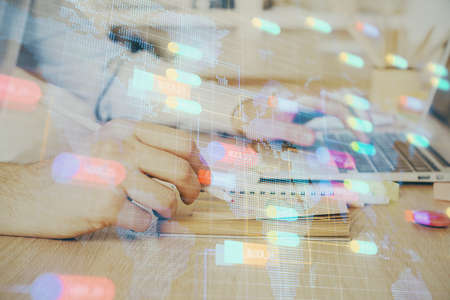A man working on computer with technology theme drawing. Concept of big data. Multi exposure.の写真素材