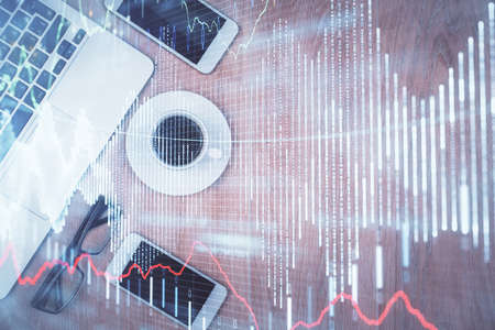 Multi exposure of financial chart hologram over desktop with phone. Top view. Mobile trade platform concept.の写真素材