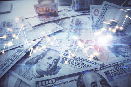 Multi exposure of forex chart drawing over us dollars bill background. Concept of financial success markets.の写真素材