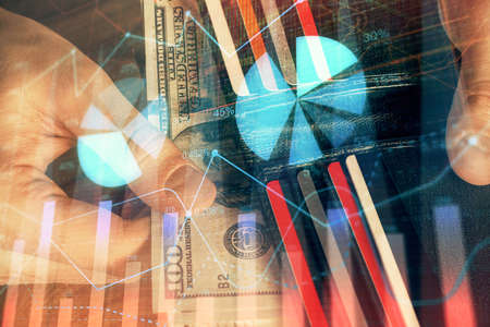 Multi exposure of forex graph drawing hologram and USA dollars bills and man hands. Technical Analysis concept.の写真素材