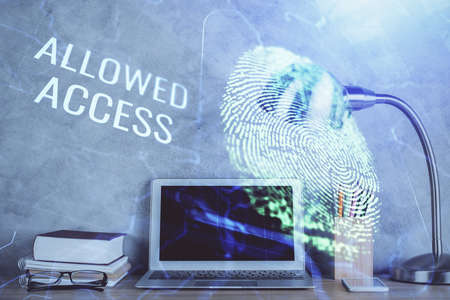 Computer on desktop in office with finger print drawing. Double exposure. Concept of business data...
