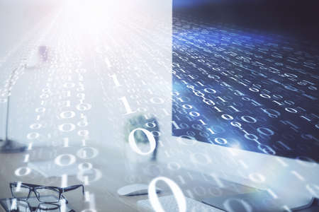 Double exposure of desktop computer and technology theme hologram. Concept of software development.の写真素材