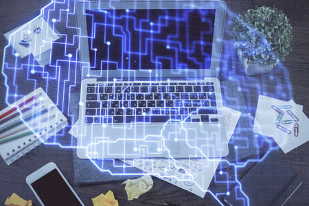 Multi exposure of work space with computer and human brain hologram. Brainstorm concept.
