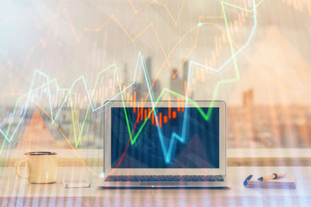 Forex Chart hologram on table with computer background. Double exposure. Concept of financial...