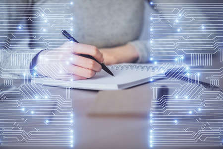 Technology theme hologram over woman's hands taking notes background. Concept of Tech. Double...