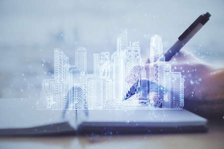 IOT drawing over writing hands in notepad background. Concept of smaert home. Multi exposure