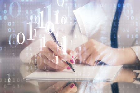 Multi exposure of woman's writing hand on background with data technology hud. Big data concept.の写真素材