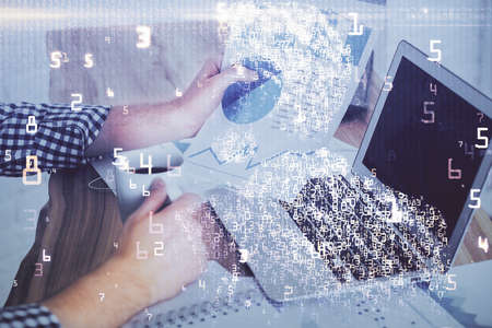 Technology theme hologram with man working on computer on background. High tech concept. Multi...