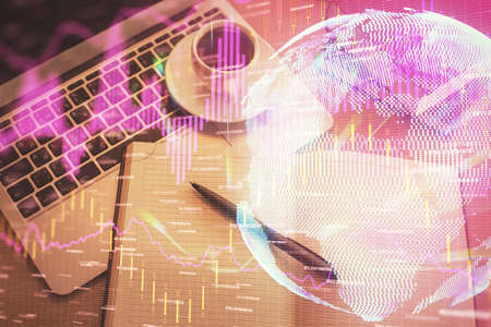 Stock market graph and top view computer on the table background. Multi exposure. Concept of...