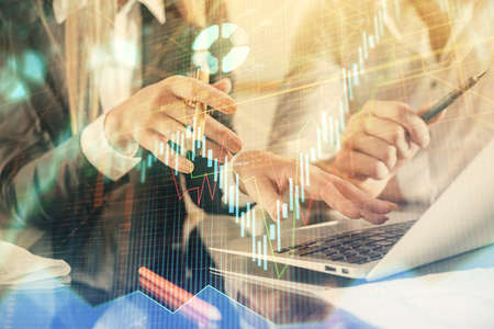 Double exposure of man and woman working together and forex chart hologram. Business concept....