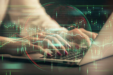 Double exposure of businesswoman hands typing on computer and forex chart hologram drawing. Financial analysis concept.の写真素材