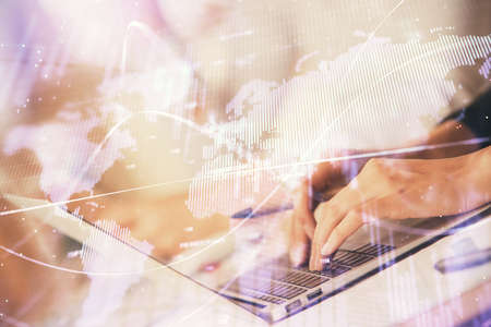 Double exposure of woman hands typing on computer and forex chart hologram drawing. Stock market...