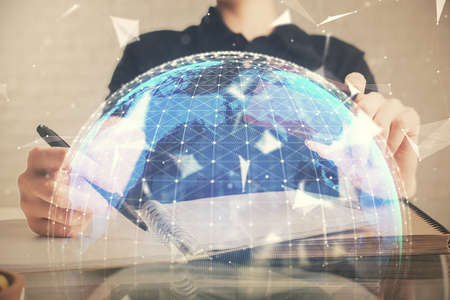 Double exposure of man hands holding a credit card and internet business theme drawing. Digital fintech and E-commerce concept.の写真素材