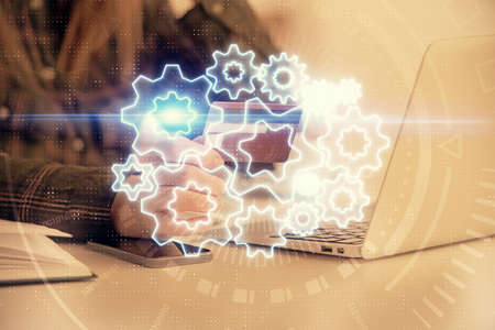 Multi exposure of woman on-line shopping holding a credit card and financial theme drawing. Business E-commerce concept.の写真素材