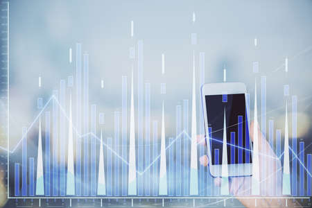 Double exposure of forex chart sketch hologram and woman holding and using a mobile device. Stock...
