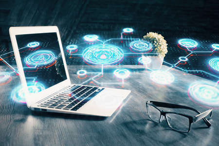 Computer on desktop with social network hologram. Multi exposure. Concept of international people...