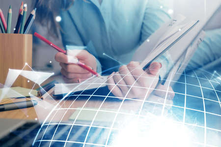 Multi exposure of hands making notes with world map hologram and data theme icons. Concept of global...