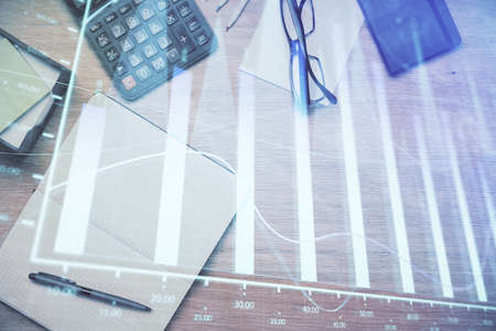 Double exposure of forex graph drawing and work table top veiw. Concept of financial analysis.
