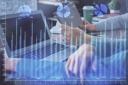 Double exposure of man and woman working together and forex chart hologram. Business concept....