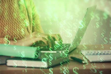 Double exposure of woman hands typing on computer and forex chart hologram drawing. Stock market analysis concept.の写真素材