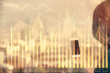 Double exposure of forex chart sketch hologram and woman holding and using a mobile device. Stock...