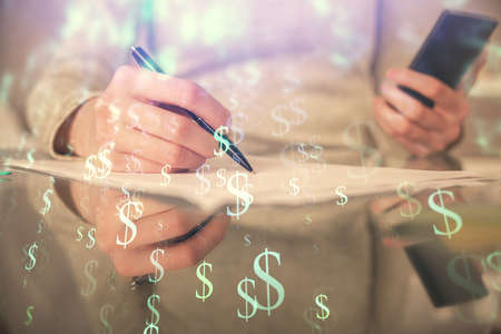 Double exposure of forex chart sketch hologram and woman holding and using a mobile device....