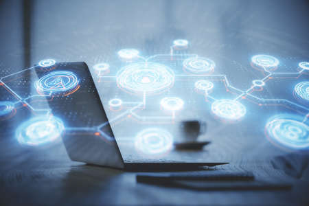 Computer on desktop with social network hologram. Double exposure. Concept of international people connections.の写真素材