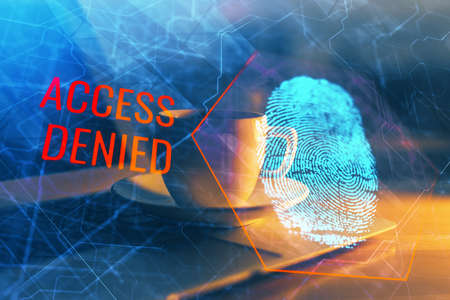 Computer on desktop in office with finger print drawing. Double exposure. Concept of business data security.の写真素材