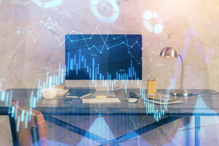Double exposure of chart and financial info and work space with computer background. Concept of...