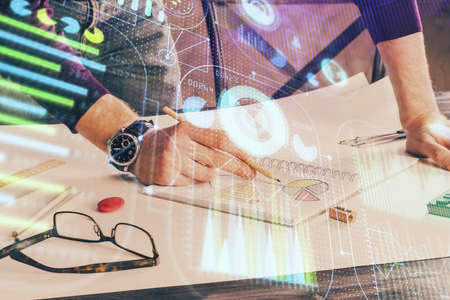 Writing man with technology icons. . Double exposure. Network and data concept.