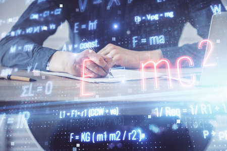 Man with mathematical and scientific formulas. Concepts of education. Symbols and equations on a...
