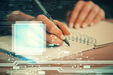 Double exposure of writing hands on background with data solution hologram on front. Technology...