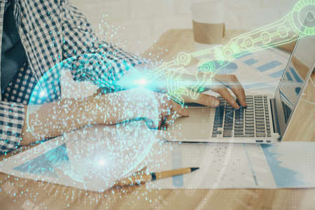 Businessman working on Laptop with technology theme drawing. Concept of big data. Double exposure.