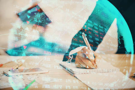 Double exposure of business theme drawing over people taking notes background. Concept of financial worldの写真素材