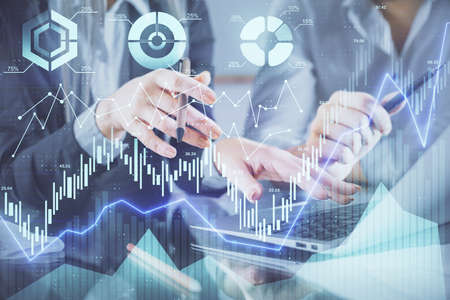Multi exposure of man and woman working together and financial chart hologram. Business concept....