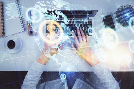 Double exposure of woman hands working on computer and forex chart hologram drawing. Top View....