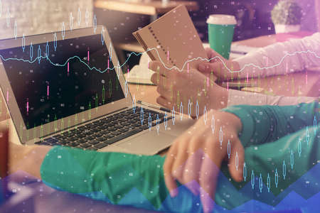 Double exposure of man and woman working together and forex chart hologram. Business concept....