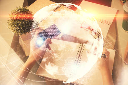 Multi exposure of woman on-line shopping holding a credit card and financial theme drawing. Business...