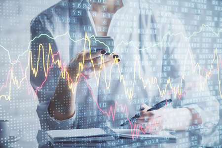 Double exposure of forex chart sketch hologram and woman holding and using a mobile device....