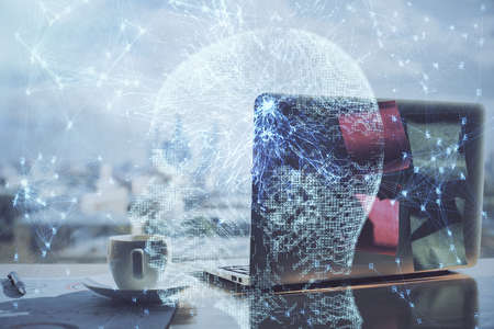 Multi exposure of work space with computer and human brain hologram. Brainstorm concept.