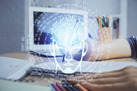 Multi exposure of writing hand on background with brain hologram. Concept of self learning.