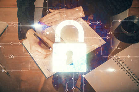 Multi exposure of woman's hands making notes with lock icon. Concept of security and protection of...