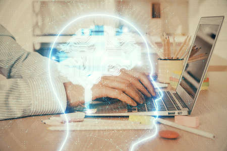 Man typing on keyboard background with brain hologram. Concept of big Data. Double exposure.