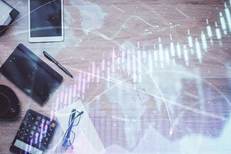 Double exposure of forex graph drawing and work table top veiw. Concept of financial analysis.