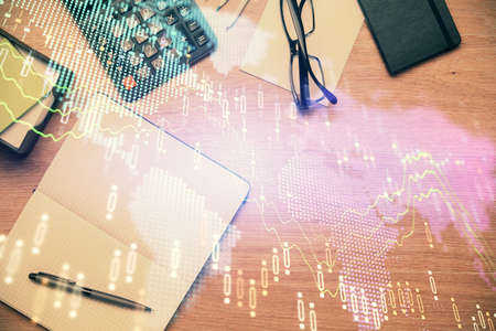 Double exposure of forex graph drawing and work table top veiw. Concept of financial analysis.