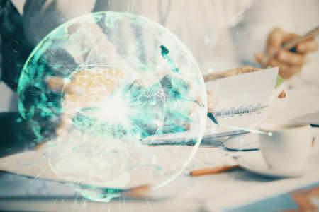 Double exposure of business theme drawing over people taking notes background. Concept of financial worldの写真素材