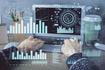 Double exposure of woman hands typing on computer and forex chart hologram drawing. Stock market...